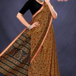 Model Wearing Gadhwal Mehndi & Black Floral Cotton Saree