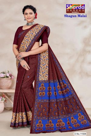 Close-up of blue floral and leaf design on Shagun Malai cotton saree with maroon base