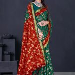 Sizzling Gold cotton saree in red and dark green with floral and leaves design