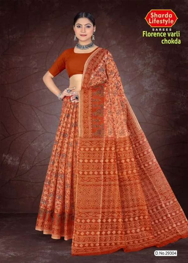 Woman dressed in a burnt orange Florence Varli Chokda saree featuring traditional Warli tribal art and Bandhani chokda motifs, styled with an earthy brown blouse and silver oxidized jewelry