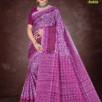 Woman draped in a vibrant magenta Florence Varli Chokda saree featuring intricate Bandhani chokda patterns and Warli tribal art, accessorized with oxidized silver jewelry