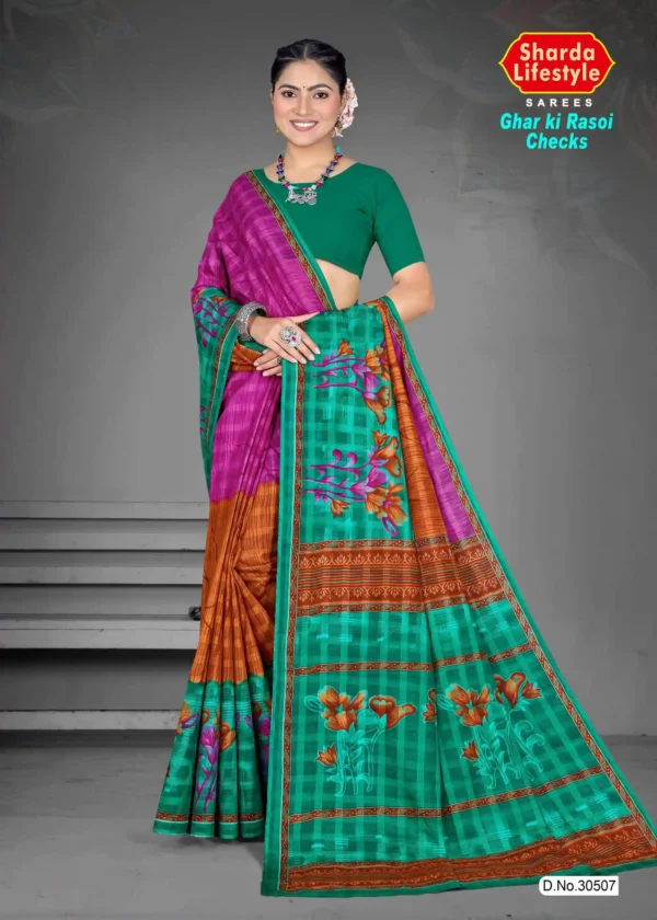 Model in Ghar ki Rasoi Checks teal green saree with rust-orange pleats and magenta pallu, detailed with floral prints