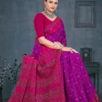 Model wearing magenta pink Maan Bawari Checks saree with traditional bandhani dots and intricate printed pallu by Sharda Sarees