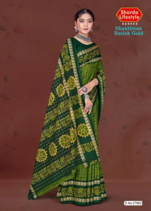 Model draped in deep green and yellow Shaktiman Batick Gold saree featuring batik floral motifs and gold zari border by Sharda Lifestyle