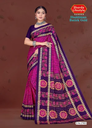 Magenta and purple Batick silk saree with golden motifs from Sharda Sarees