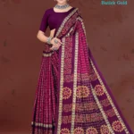 Model in Sharda magenta batick silk saree with golden floral motifs and checkered pallu