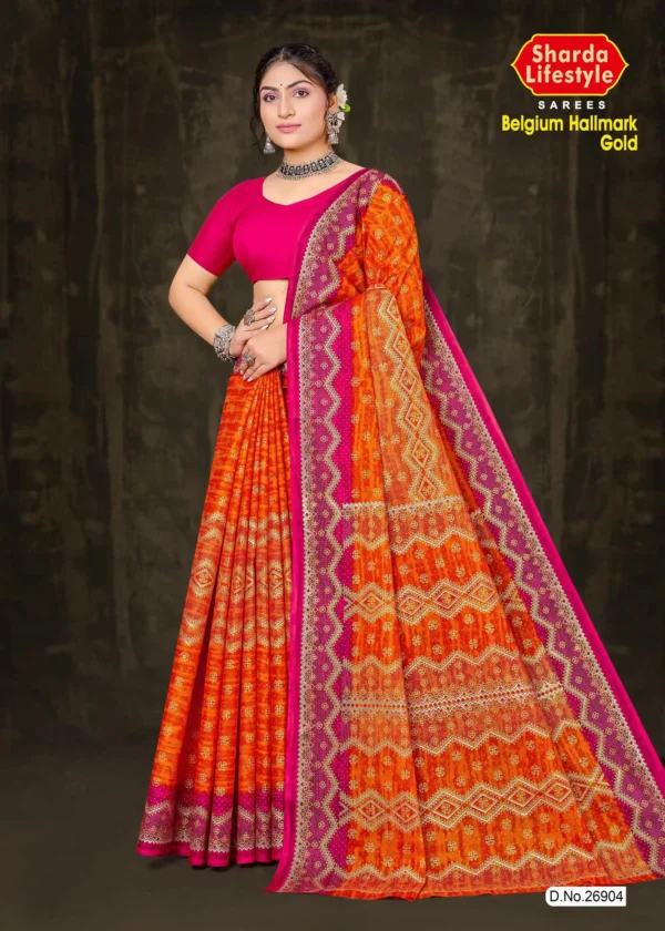 Tangerine Glow saree by Sharda Sarees featuring vibrant tangerine silk with golden zari work, perfect for weddings and festive occasions.
