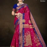 Model wearing Hybrid Copper Border rani pink saree with royal blue blouse and antique copper zari peacock motif on pallu