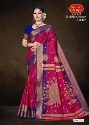 Model wearing Hybrid Copper Border rani pink saree with royal blue blouse and antique copper zari peacock motif on pallu