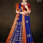 Model wearing royal blue Hybrid Copper Border saree with maroon blouse and antique copper zari temple motifs
