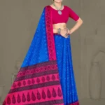 Model wearing Ikkat Puri saree in sapphire blue and rani pink with ikkat weave and bold tribal pallu