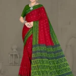 Model wearing a red and green Ikkat Puri saree with geometric motifs and a contrasting pallu, designed for festive and traditional wear.