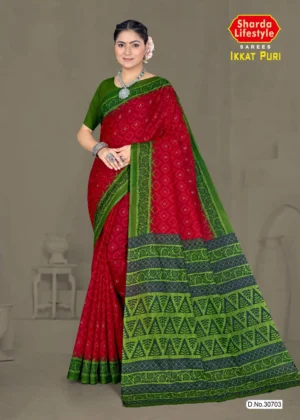 Model wearing a red and green Ikkat Puri saree with geometric motifs and a contrasting pallu, designed for festive and traditional wear.