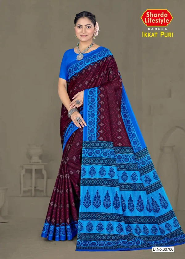 Model draped in maroon and blue ikat saree with floral pallu from the Ikkat Puri collection.