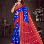 Model in Israel Gold Royal Blue & Red Saree from Sharda Sarees with golden motifs, red zari border, and striped pallu