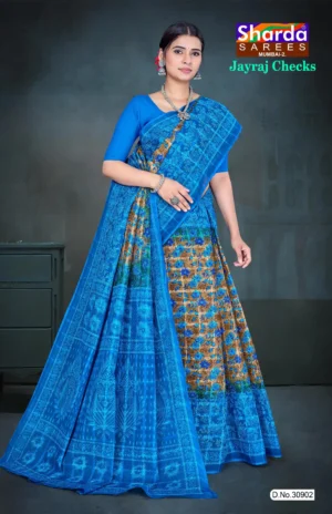 Woman in royal blue Jayraj Checks saree with golden floral body and blue woven pallu featuring peacock motifs by Sharda Sarees