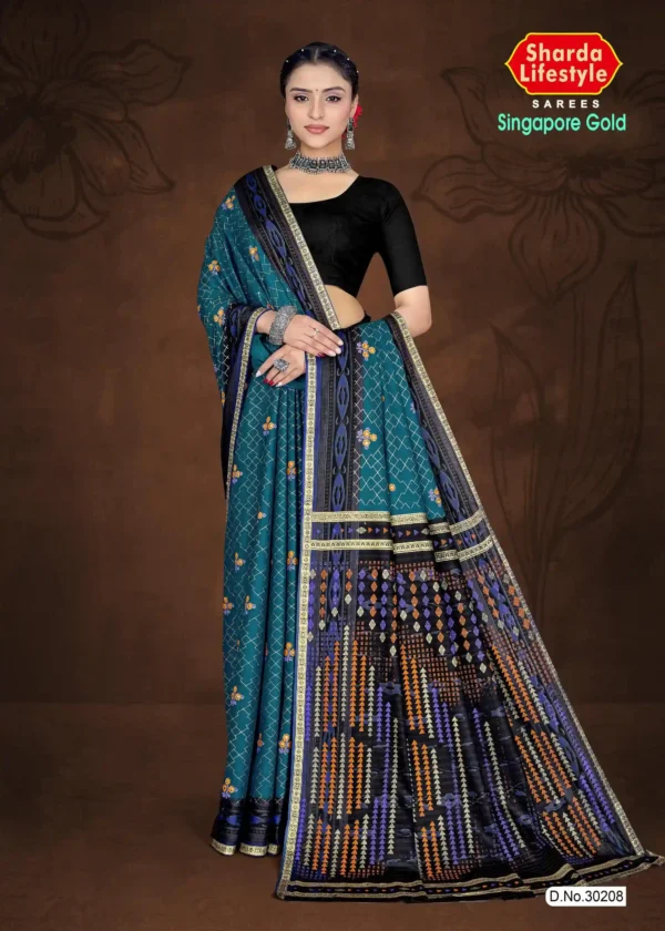 Model wearing a teal blue saree with a dramatic black geometric pallu from Sharda Lifestyle’s Singapore Gold – Design No. 30208