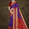 Model wearing royal blue and red floral saree with rich golden zari border from Sizzling Sona by Sharda