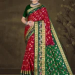 Model wearing red and green floral silk saree with golden zari border from Sizzling Sona by Sharda