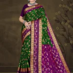 Woman wearing green and purple silk saree with golden zari border from Sharda Sizzling Sona collection