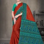 Rust orange and green Sone Pe Shuhaga saree with intricate blue floral weave from Sharda Sarees