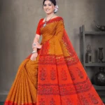 Mustard yellow and red Sone Pe Shuhaga saree with intricate floral border from Sharda Sarees